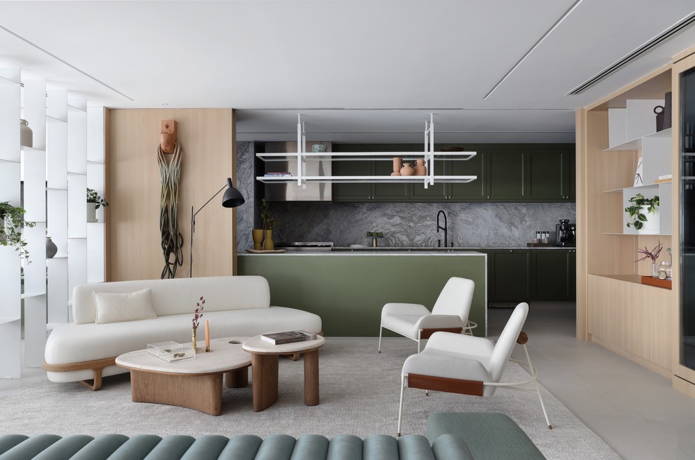 Apartamento integrado tem cozinha verde e varanda gourmet