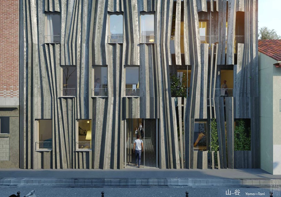 Ao norte de Paris, este edifício “origami” de Kengo Kuma e REI Habitat exibe uma fachada esculpida em madeira cinza, em ressonância com o seu ambiente urbano — Foto: REI Habitat